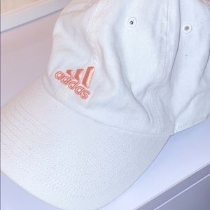 Women’s white Adidas fitted hat.